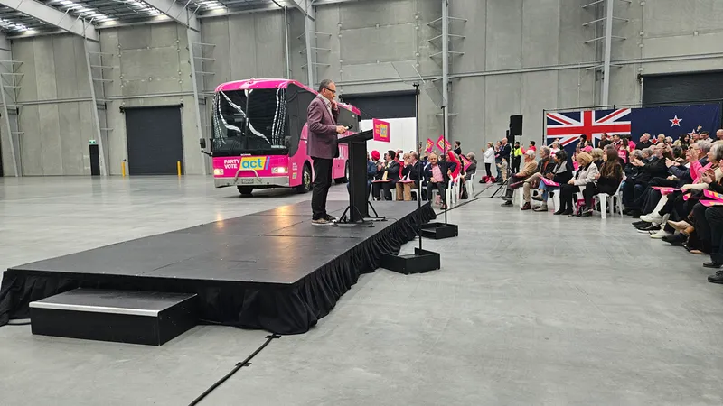 The fluro bink bus arriving to Act's launch. 