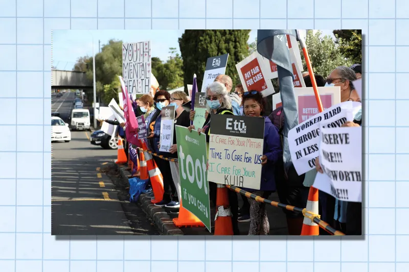 People protesting with placards.