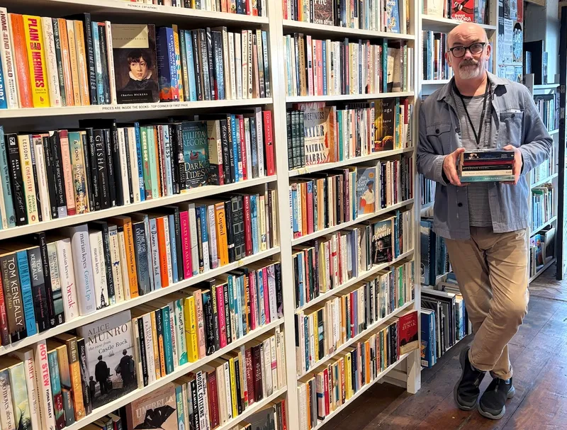 Roy Ward, the co-owner of The Green Dolphin Bookstore.