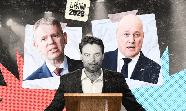 Man at lectern with two men in pictures behind them