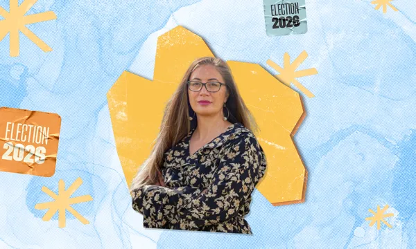 Portrait of Huhana Lyndon wearing glasses and a floral top, set against an orange polygon on a light blue dotted background with "Election 2026" graphics.   