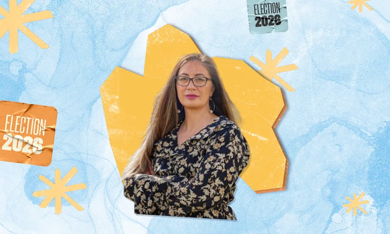 Portrait of Huhana Lyndon wearing glasses and a floral top, set against an orange polygon on a light blue dotted background with "Election 2026" graphics.   