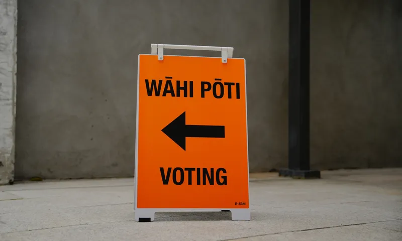 An orange election sign reading "wāhi pōti – voting" with a black arrow pointing left