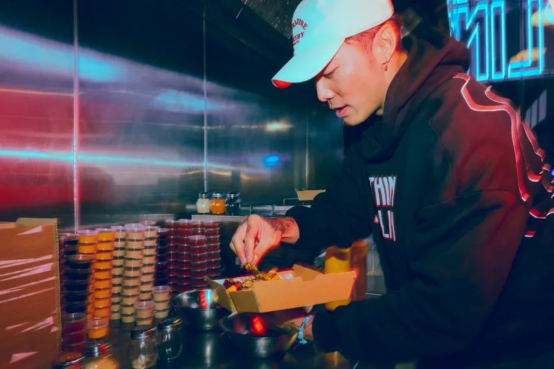 Shane Liu preparing dumplings at Sumthin' Dumplin'