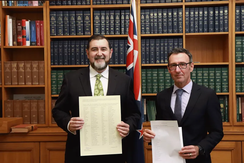 David Wilson and Karl Le Quesne with the writ. Credit: Office of the Clerk