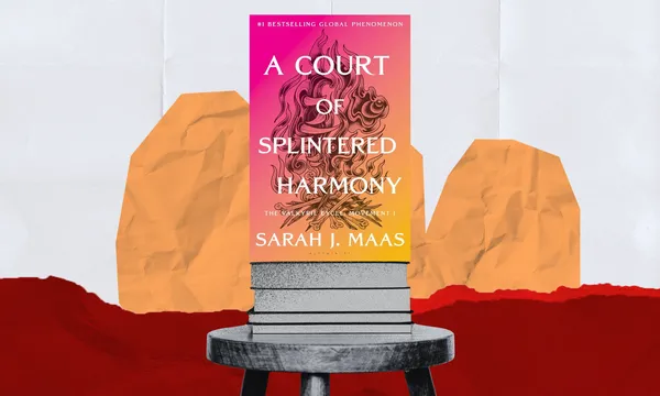 A Court of Thorns and Roses cover on a stool with colourful shapes behind it.